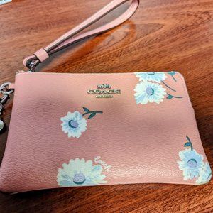 Coach floral wristlet with charms!  Great condition